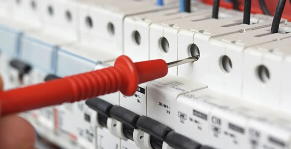 Electrical contractor testing circuit breakers during electrical repair in Cicero, IL