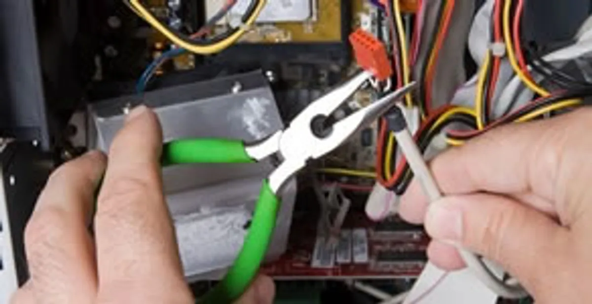 Licensed electrical contractor performing electrical repair with tools in Forest Park, IL