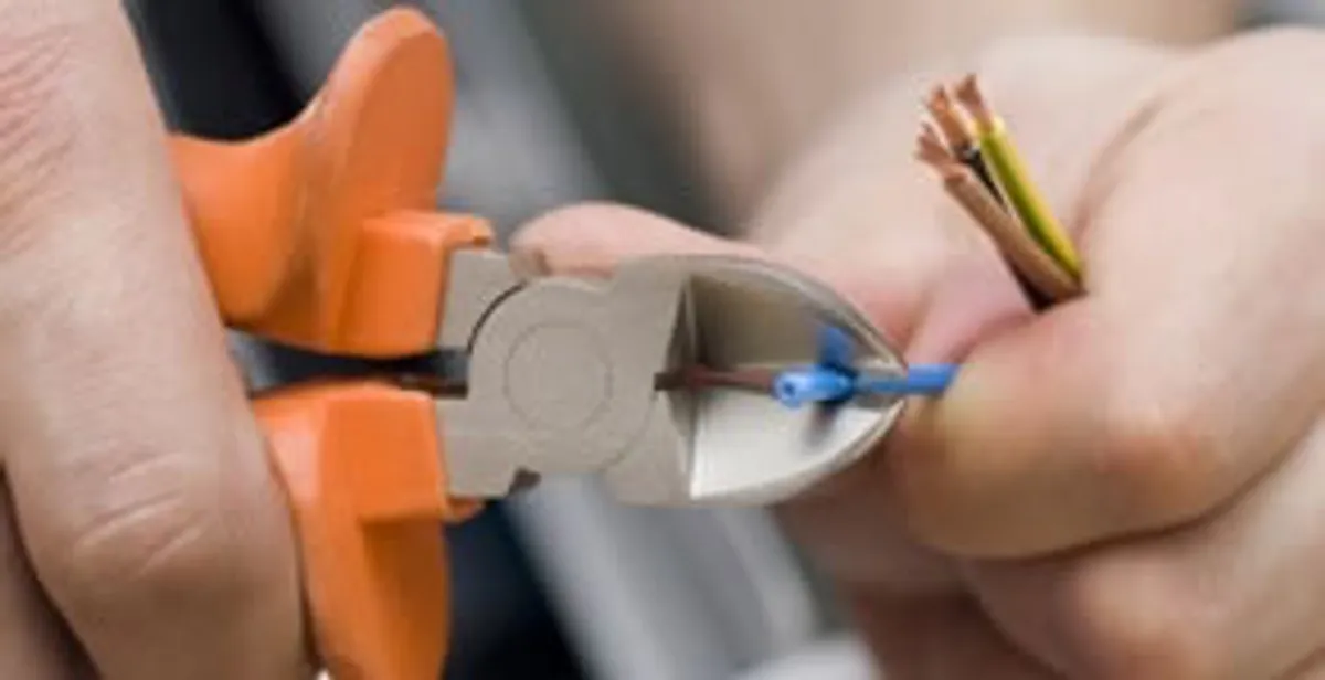 professional electrical services showing precise wire cutting by licensed electricians in Chicago, IL